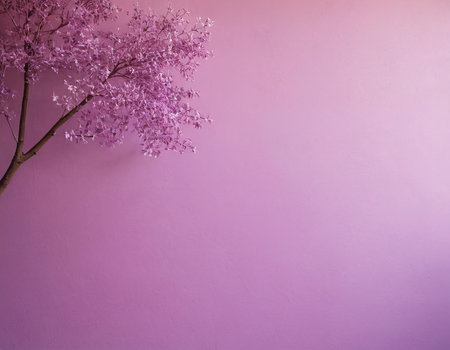 Pink tree on purple wall background with copy space for your text.の素材