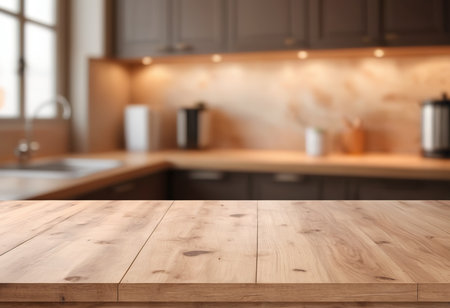 Empty wooden table in front of blurred kitchen interior. Mock up for designの素材
