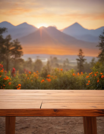 Empty wooden table against scenic view of mountain range in the valley at sunsetの素材