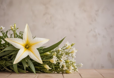 bouquet of white lilies on a wooden table with copy spaceの素材