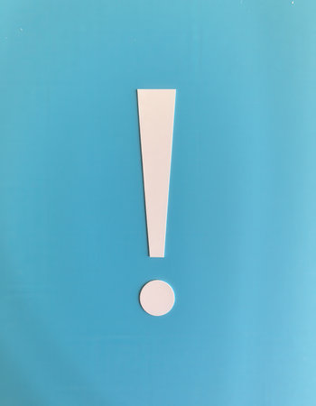 Exclamation mark on a blue background. White exclamation mark.の素材