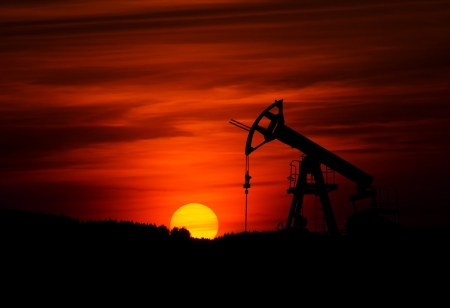 Small oil pump during sunsetの写真素材