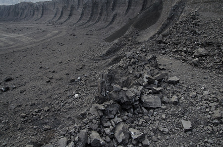 Layers of rough brown coal in the open pit mine