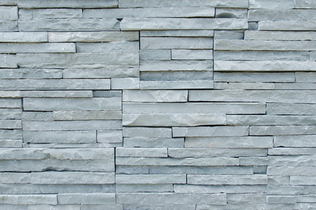 Detail of thin limestone slabs tiling on the wall