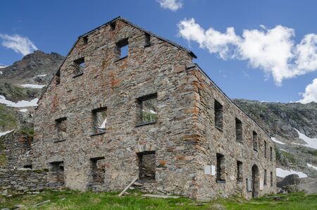 Ruined stone building of the abandoned gold mine under Hohe Sonnblick peak, Hohe Tauern NP, Austriaの写真素材