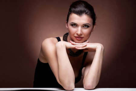 Portrait of luxury woman in exclusive jewelry on natural backgroundの写真素材