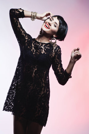 Studio shot of  Sexy Fashionl Woman in Black Guipure Dress. Professional Makeup and Hairstyleの写真素材
