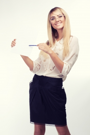 Portrait of happy woman with travel magazineの写真素材