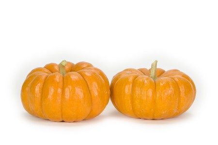 Two mini pumpkins in isolation.の写真素材
