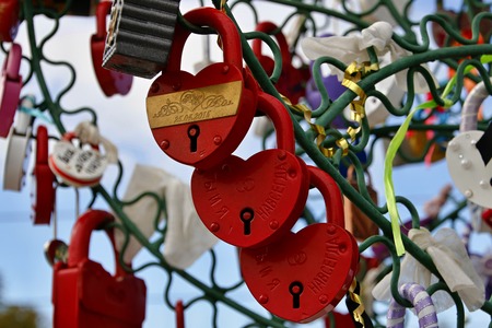 Closed padlocks in the form of heartの写真素材
