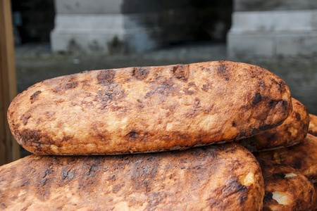 Freshly baked traditional bread on wooden table