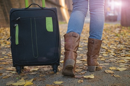woman tourist traveling on the streets of European cities in the autumnの写真素材