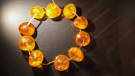 Amber. Vintage beads of amber on a dark backgroundの写真素材