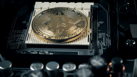 Bitcoins on the motherboard.の写真素材