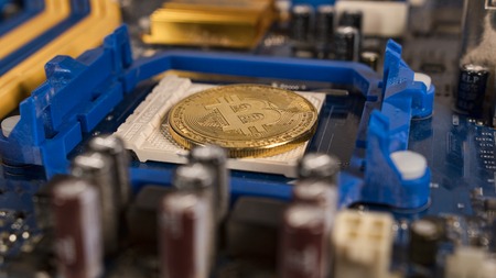 Bitcoin on the motherboard. Crypto currency Gold Bitcoin - BTC - Bit Coin