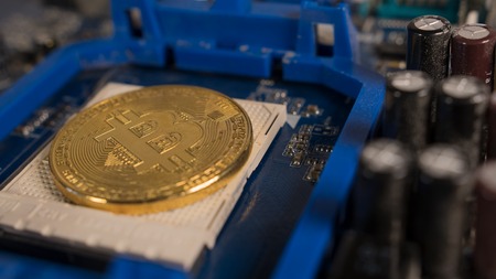 Bitcoin on the motherboard. Crypto currency Gold Bitcoin - BTC - Bit Coin
