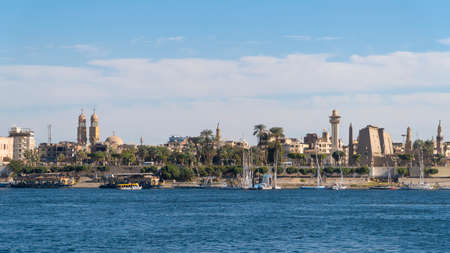 Luxor, Egypt - January 2020: Nile embankment with boats and Luxor Temple in Luxor, beautiful landscape, Egyptのeditorial素材