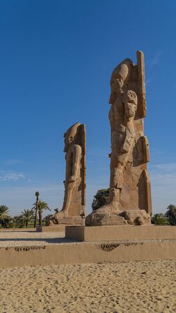 The two colossi of Amenhotep III at the northern gate of the temple of Amenhotep III. Luxor. Egyptの写真素材