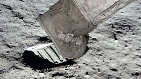 3D rendering. Lunar astronaut walking on the moons surface and leaves a footprint in the lunar soil. CG Animation.の写真素材