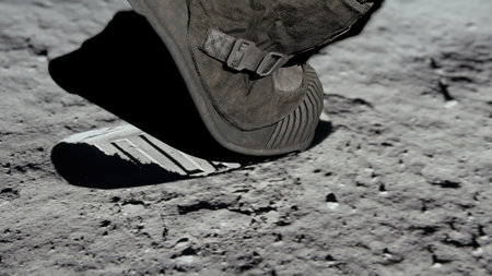 3D rendering. Lunar astronaut walking on the moon's surface and leaves a footprint in the lunar soil. CG Animation.の写真素材