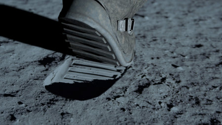 3D rendering. Lunar astronaut walking on the moon's surface and leaves a footprint in the lunar soil. CG Animation. 3d renderingの写真素材