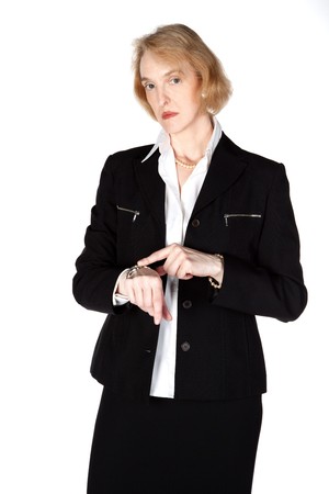 Business woman waiting impatiently for her employeeの写真素材