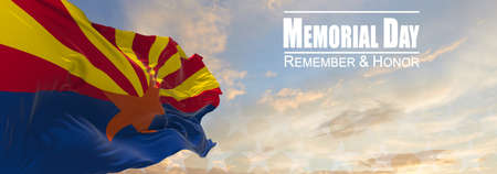 Flag of Arizona being waved in the breeze against a sunset sky and the text Memorial Day, remember and honor. Copy space. 3d illustration.の写真素材