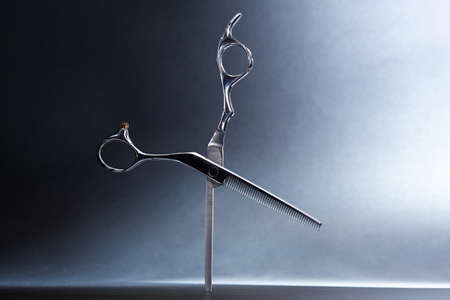 japanese professional hairdressers thinning scissors on black background. Beauty salon equipment. Stylish Professional Barber, Haircut accessories.の写真素材