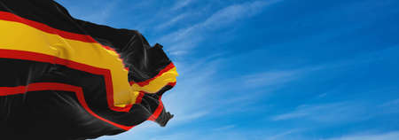 Rubber Fetish Pride flag waving in the wind at cloudy sky. Freedom and love concept. Pride month. activism, community and freedom Concept. Copy space. 3d illustration,の写真素材