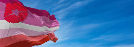 Lipstick lesbian Pride flag waving in the wind at cloudy sky. Freedom and love concept. Pride month. activism, community and freedom Concept. Copy space. 3d illustration,の写真素材