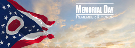 Flag of Ohio being waved in the breeze against a sunset sky and the text Memorial Day, remember and...