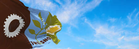 flag of Fresno, California at cloudy sky background on sunset, panoramic view. Patriotic concept about Fresno, California and copy space for wide banner. 3d illustration.の写真素材