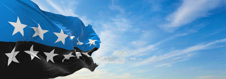 Minsk, Belarus - May, 2021: Flag of European Coal and Steel Community 12 Star Version waving in the wind at flagpole on background of blue sky. 3d illustration.の写真素材