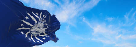 flag of Cambridge, Massachusetts at cloudy sky background on sunset, panoramic view. Patriotic concept about Cambridge, Massachusetts and copy space for wide banner. 3d illustration.の写真素材