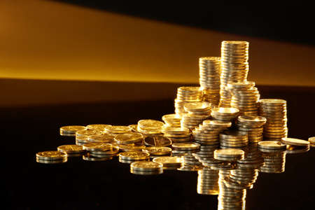 stacks of Golden coins. Money, Financial, Business Growth concept. Finance background.の写真素材