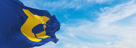 official flag of Tokushima prefecture waving in the wind on flagpoles against sky with clouds on sunny day. Japan Patriotic concept. 3d illustration.の写真素材