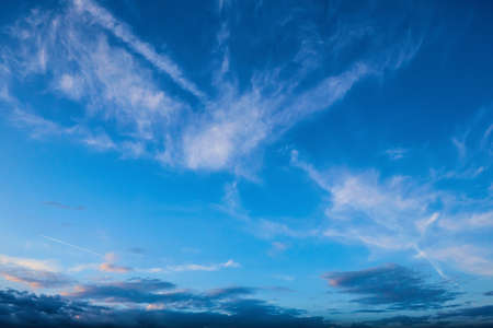 Panorama of Calm evening sky with clouds. Sky background after sunset. Sunrise sky with lighted clouds, Beauty evening sunrise over seaの写真素材