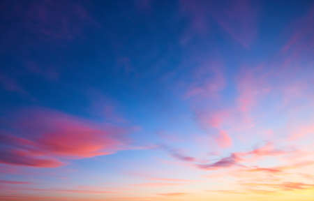 Panorama of evening sky with clouds. sunset Sky background, Sunrise sky with lighted clouds. Beauty evening sunrise over seaの写真素材