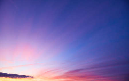Panorama of Calm evening sky with clouds. Sky background after sunset. Sunrise sky with lighted clouds, Beauty evening sunrise over seaの写真素材