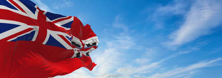 flag of Trinity House Ensign  at cloudy sky background on sunset. panoramic view. united kingdom of...