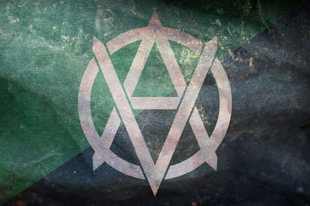 Top view of retro flag of Veganarchism, whiteVA with grunge texture. Anarchism symbol. no flagpole,...