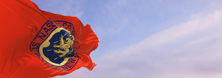 flag of county Nassau, New York , USA at cloudy sky background on sunset, panoramic view, Patriotic concept about Nassau, New York and copy space for wide banner. 3d illustrationの写真素材