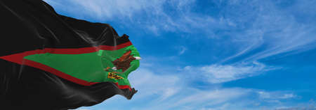 flag of African Americans of American Samoa state, untied states of America at cloudy sky background on sunset, panoramic view. copy space for wide banner. 3d illustrationの写真素材