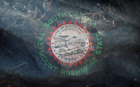 Top view of retro flag of African Americans of South Dakota state, untied states of America with grunge texture. USA Juneteenth Freedom Day. no flagpole. Plane design layout. Flag backgroundの写真素材