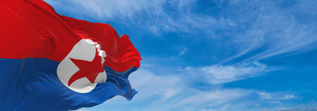 flag of National Liberation Front of Southern Korea , South Korea at cloudy sky background on sunset, panoramic view. Korean travel and patriot concept. copy space for wide banner. 3d illustrationの写真素材