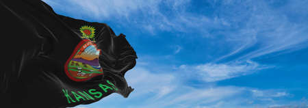 flag of African Americans of Kansas state, untied states of America at cloudy sky background on sunset, panoramic view. copy space for wide banner. 3d illustrationの写真素材