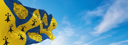 flag of county Shropshire, UK at cloudy sky background on sunset, panoramic view. County of united kingdom of great Britain, England. copy space for wide banner, 3d illustrationの写真素材