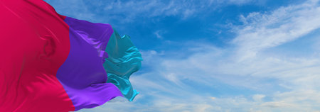flag of Androgyne pride waving in the wind at cloudy sky. Freedom and love concept. Pride month. activism, community and freedom Concept. Copy space. 3d illustrationの写真素材