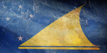 Top view of official retro flag Tokelau with grunge texture. patriot and travel concept. no flagpole. Plane design, layout. Flag backgroundの写真素材