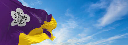 flag of Flore village  at cloudy sky background on sunset. panoramic view. united kingdom of great...